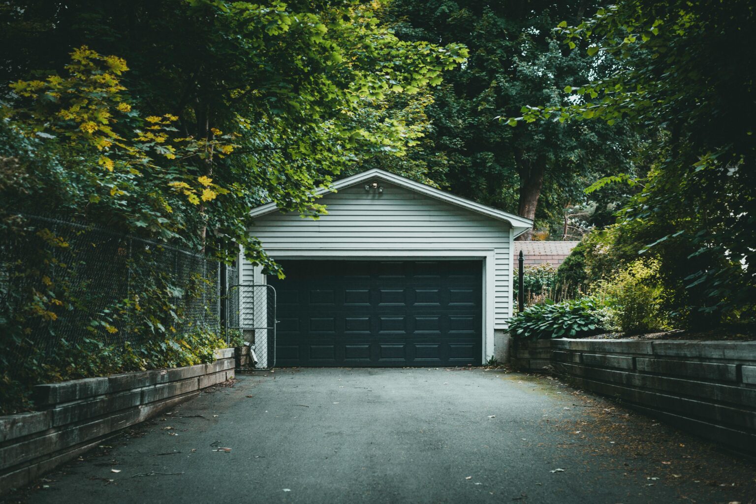 Single garage door on a wooded property in Kitsap County, Washington